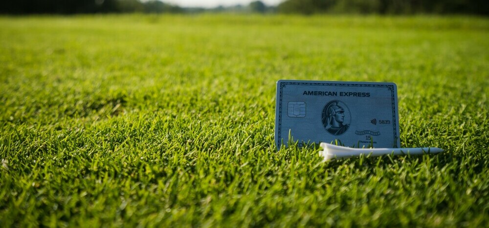 credit card next to a golf tee